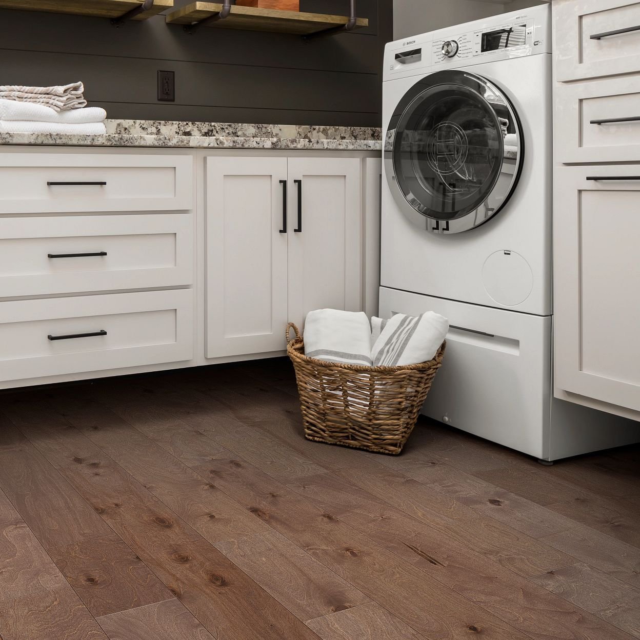 laundry room with hardwood floors