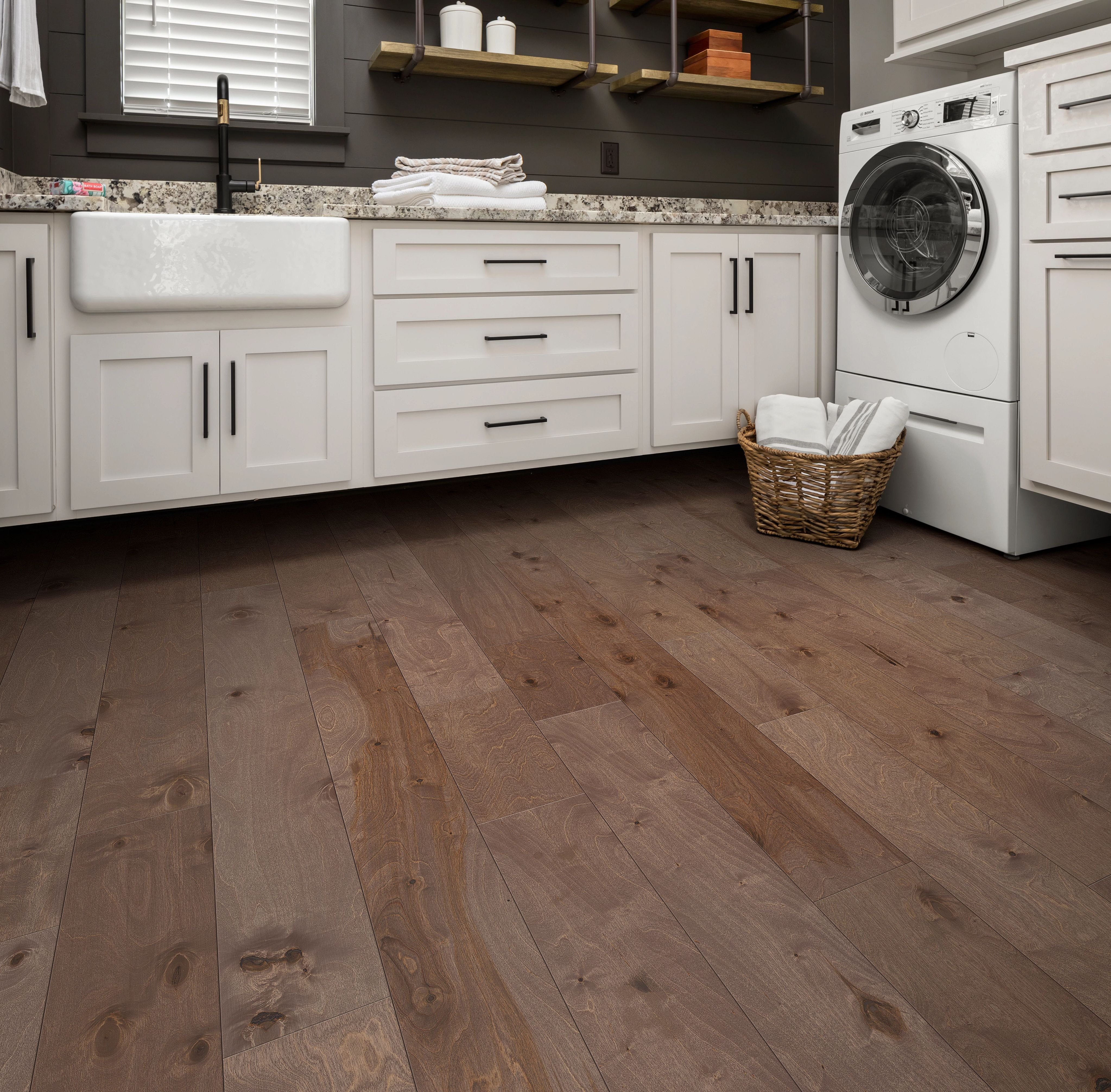 laundry room with hardwood floors