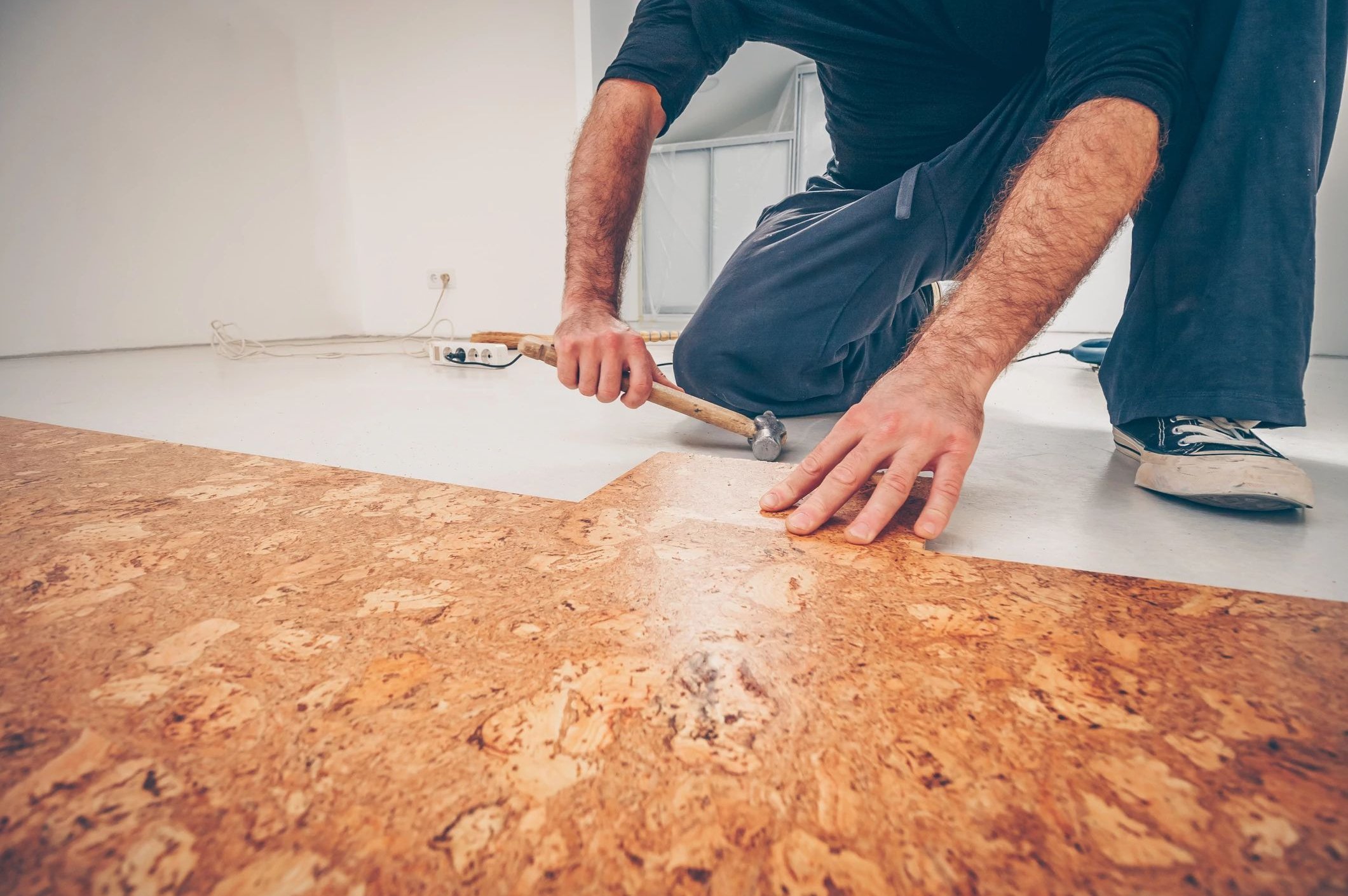 person installing cork floor