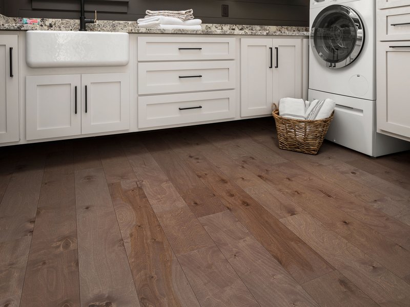 laundry room with hardwood floors