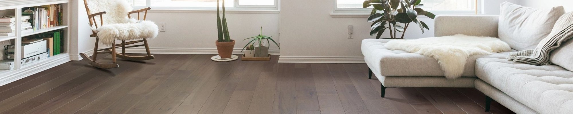 living room with hardwood floors and a white couch